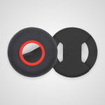 Two black circular foam or rubber pads with cutouts, shown on a light gray background. One pad has a red ring accent around the center hole, and the other shows the interior cutout shape.
