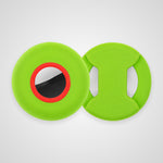 Two bright lime green silicone dog toys on a light gray background. One toy shows a circular opening with a red ring and a black-and-white reflective center, while the other shows two handle cutouts.