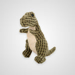 A plush dinosaur toy made from textured olive green corduroy fabric with a cream-colored belly and small black eyes, shown on a light gray background.