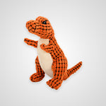 An orange and black textured plush dinosaur toy with a cream-colored belly, standing against a light gray background.