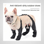 A light cream French Bulldog wearing black anti-fall and anti-dirty outdoor dog boots with a matching harness, shown against a white background with text overlays.