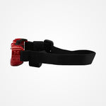 A red and black headlamp with an adjustable black strap, shown in profile against a plain white background.