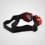 Red heart-shaped goggles with a black adjustable strap and black buckle, shown on a light gray background.